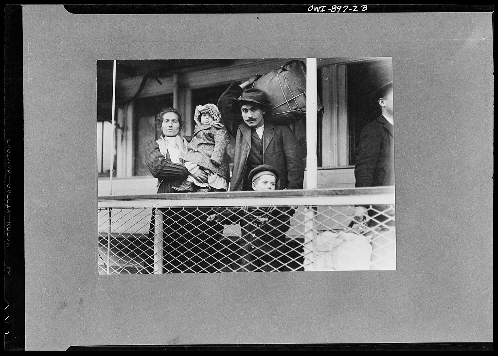 Lewis Hine photograph of an Italian immigrant family on a ferry leaving Ellis Island in 1905